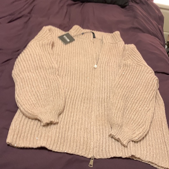 It’s a beautiful sweater with sequins in a beige color. - Picture 4 of 7